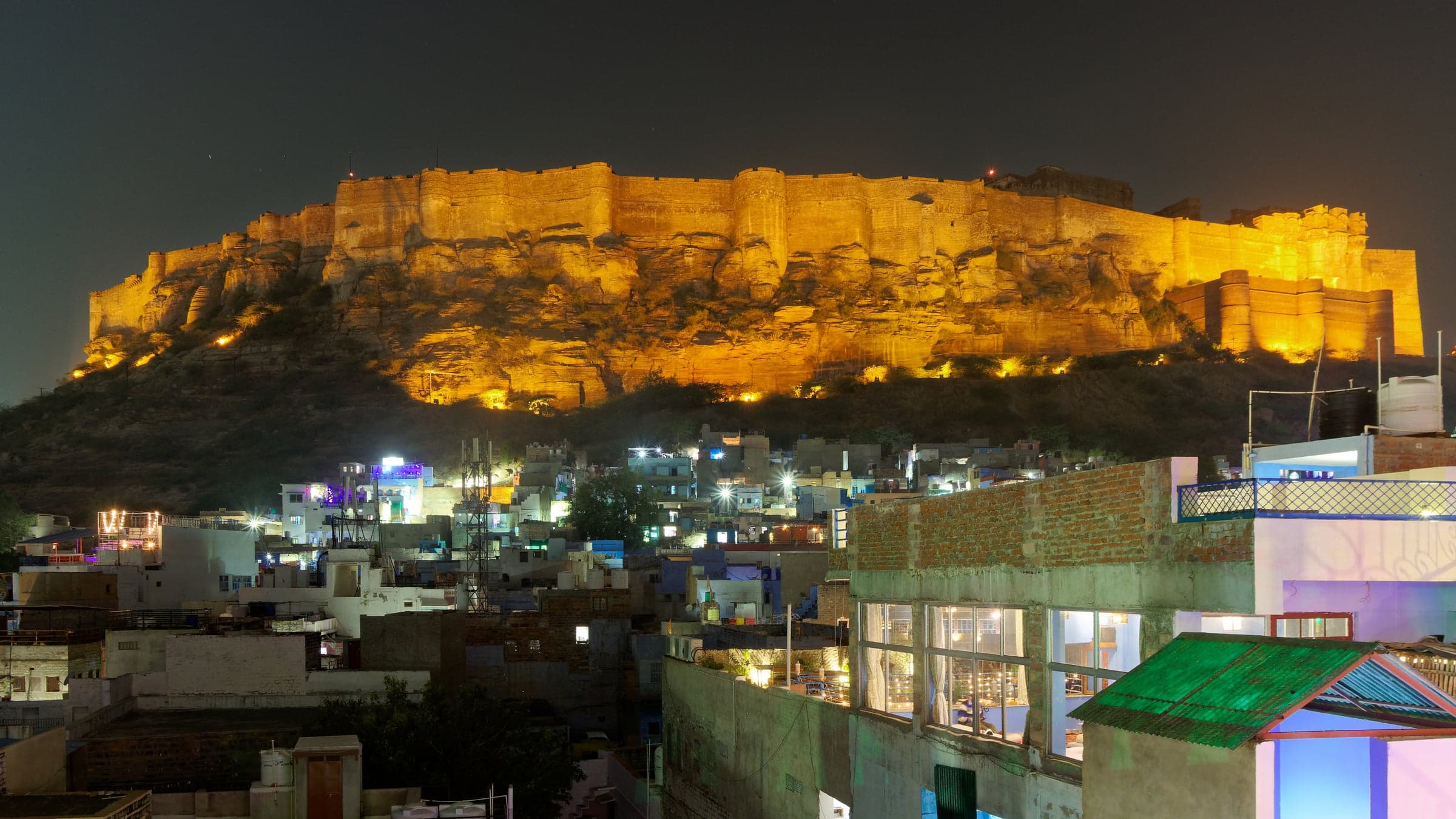 Mehrangarh Fort lit up at night over the Blue City of Jodhpur